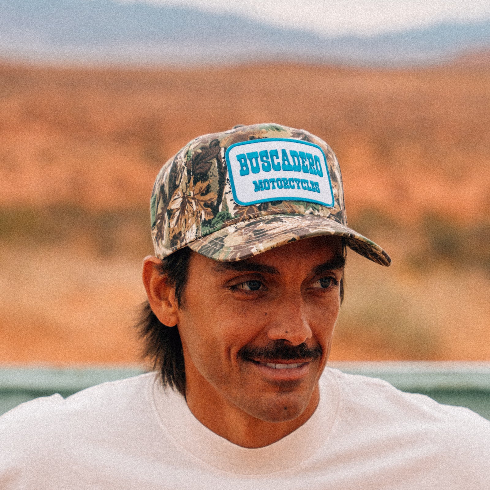 'Blue Barrel' 5 Panel Trucker Hat - Camo